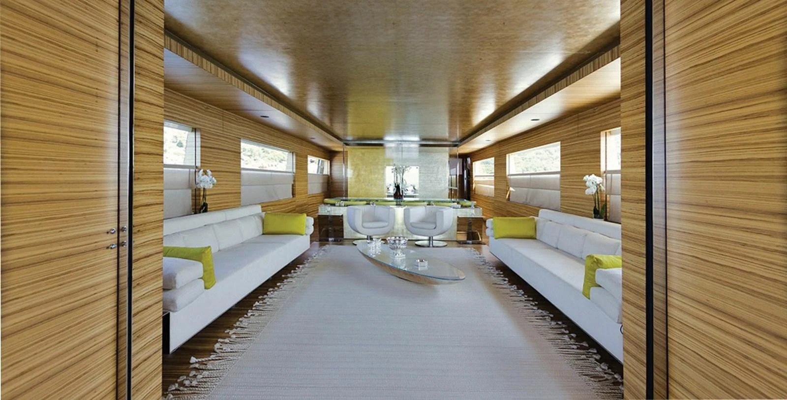 The salon features a spacious and elegantly designed seating area with modern furnishings and ample natural light. aboard MABROUK Yacht for Sale