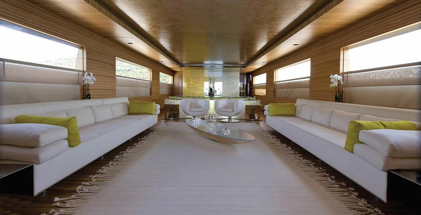 The salon features luxurious seating with elegant decor and ample natural light. aboard MABROUK Yacht for Sale