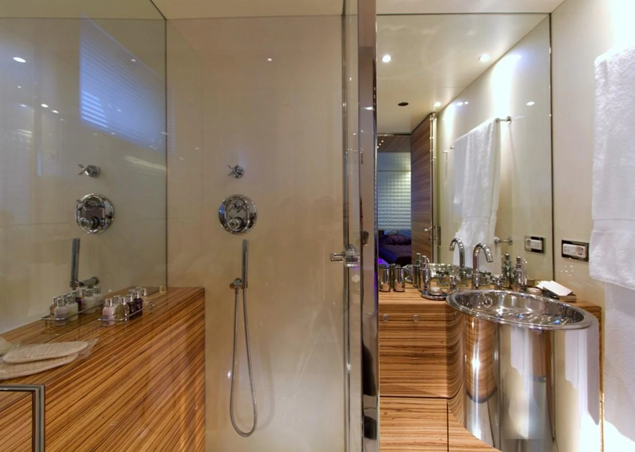 The yacht's bathroom features a sleek, modern design with high-end fixtures and finishes. aboard MABROUK Yacht for Sale