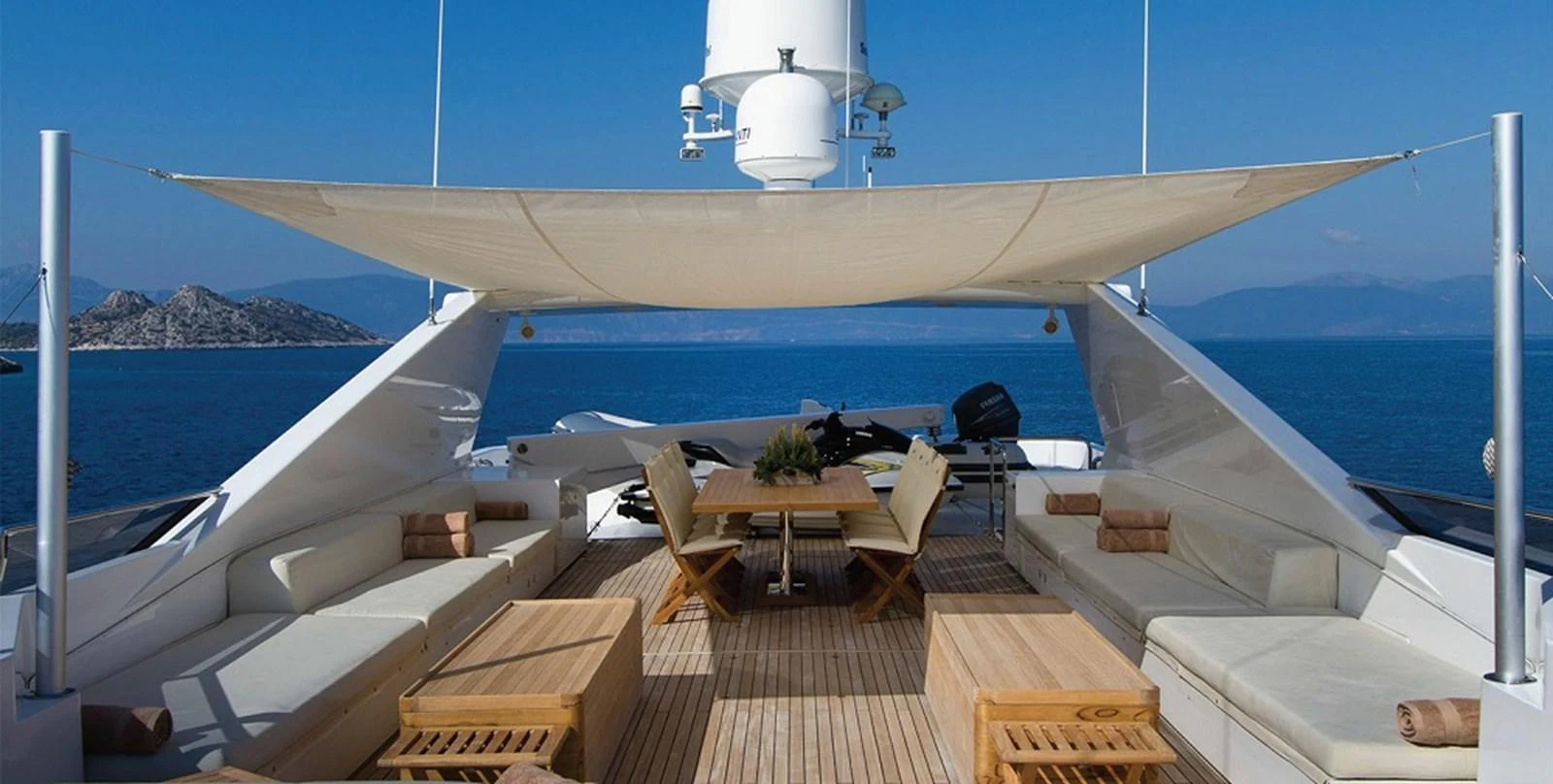 The sundeck offers a luxurious outdoor lounging and dining area with stunning sea views. aboard MABROUK Yacht for Sale