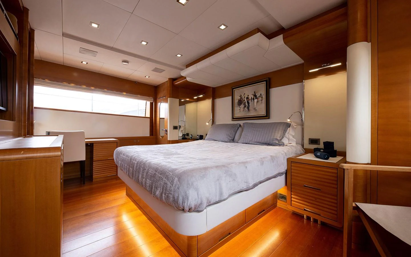 The master stateroom features a spacious bed, elegant wood finishes, and ample natural light. aboard SOFIA OF TORTOLA Yacht for Sale