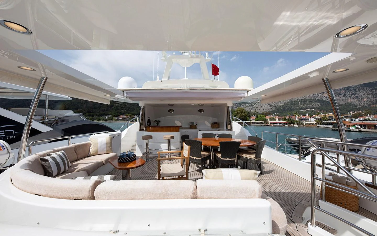 The aft deck offers a spacious and inviting area for relaxation and socializing with comfortable seating and scenic views. aboard SOFIA OF TORTOLA Yacht for Sale