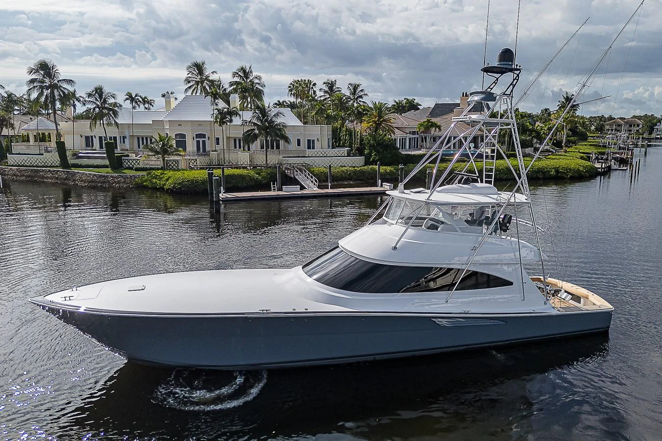 A sleek and modern yacht glides gracefully on calm waters, showcasing its elegant design. aboard LADY SURFBUM Yacht for Sale
