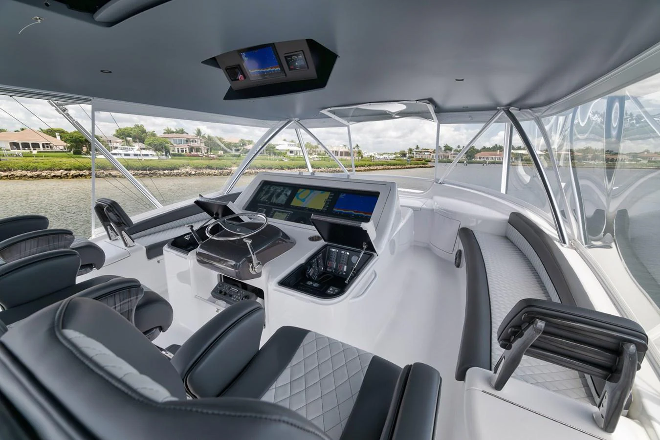 The helm station offers a sleek and modern design with advanced navigation equipment and comfortable seating. aboard LADY SURFBUM Yacht for Sale