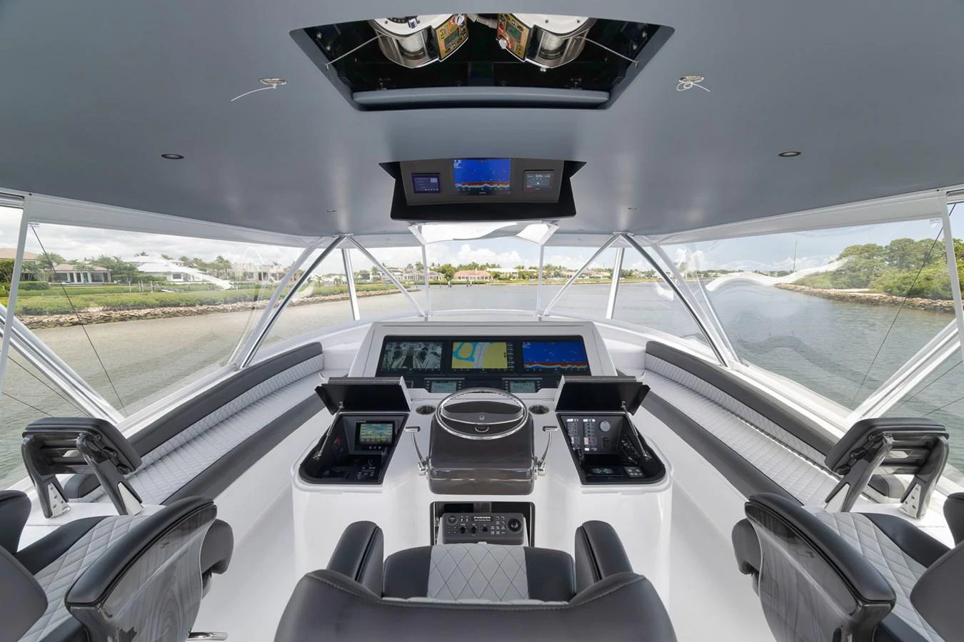 The helm station offers a commanding view with state-of-the-art navigation equipment and luxurious seating. aboard LADY SURFBUM Yacht for Sale