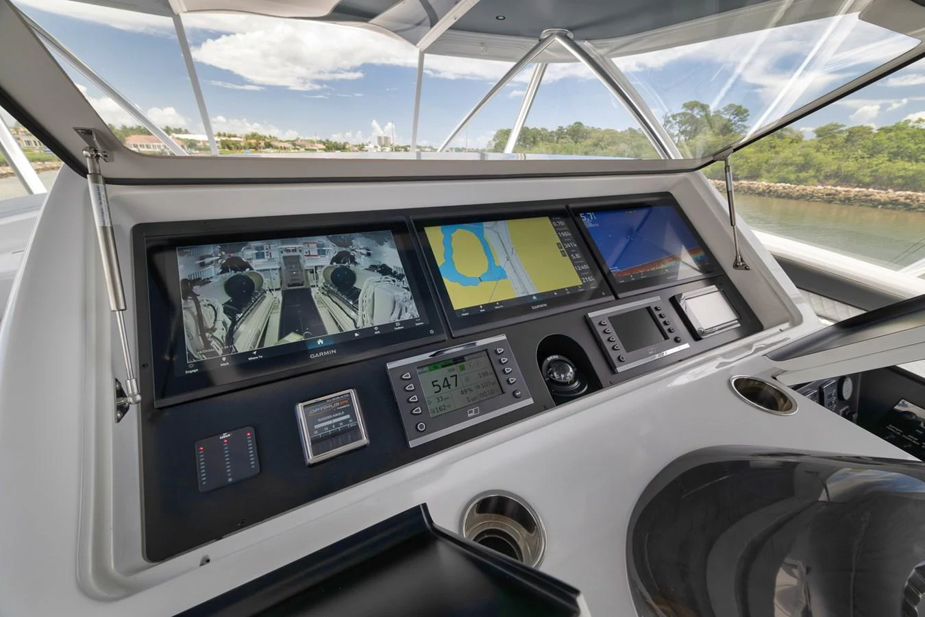 The helm station features advanced navigation equipment and a sleek, modern design. aboard LADY SURFBUM Yacht for Sale