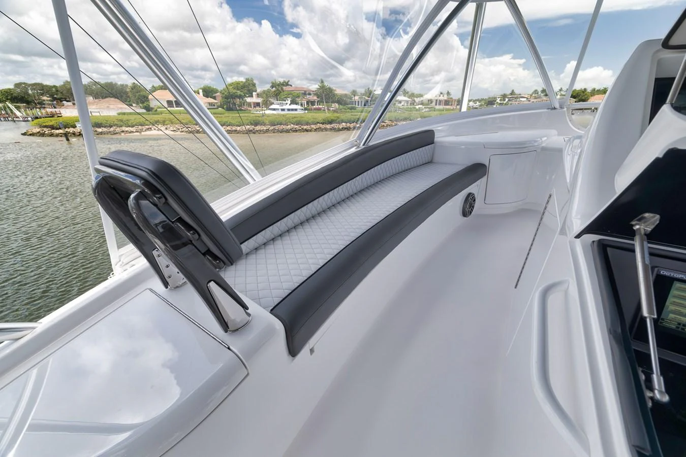 The helm area features a sleek, modern seating arrangement with panoramic views. aboard LADY SURFBUM Yacht for Sale