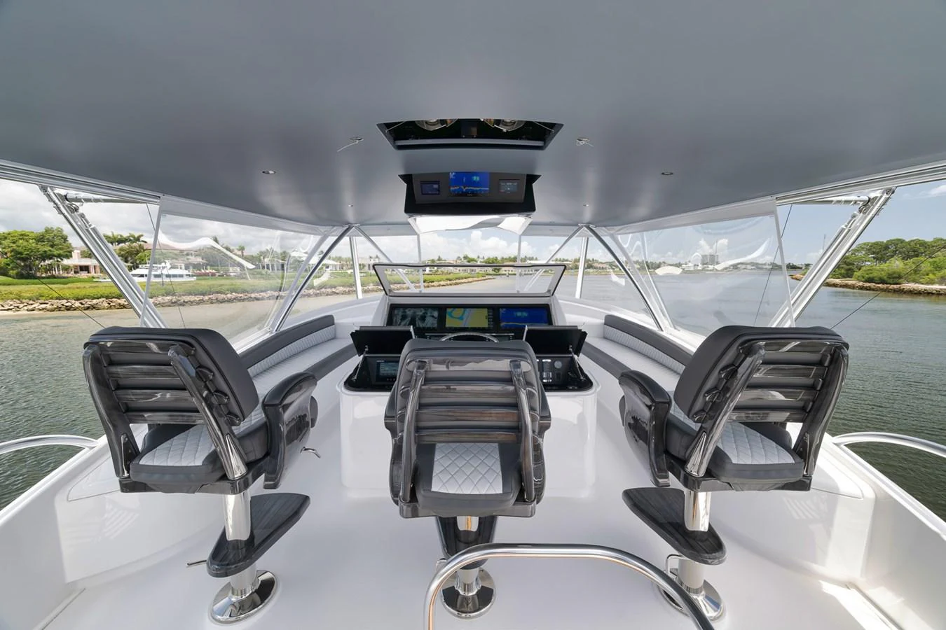 The helm station offers a commanding view with state-of-the-art navigation equipment and comfortable seating. aboard LADY SURFBUM Yacht for Sale