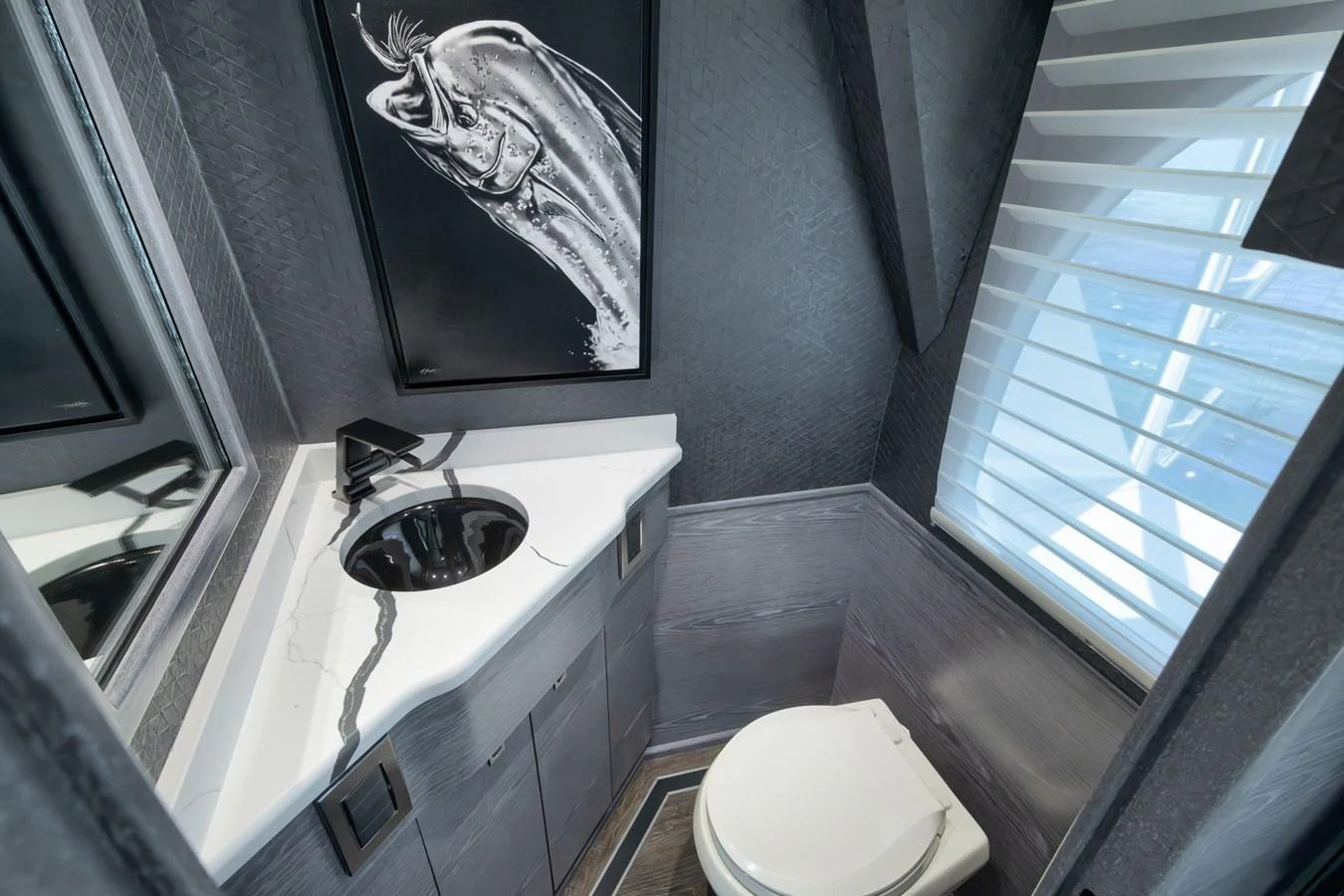 A sleek and modern yacht bathroom with stylish fixtures and a large window. aboard LADY SURFBUM Yacht for Sale