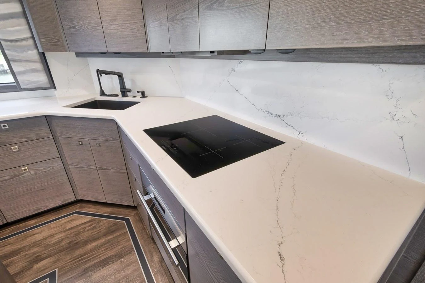 The yacht's galley features modern appliances and sleek countertops, perfect for gourmet cooking at sea. aboard LADY SURFBUM Yacht for Sale
