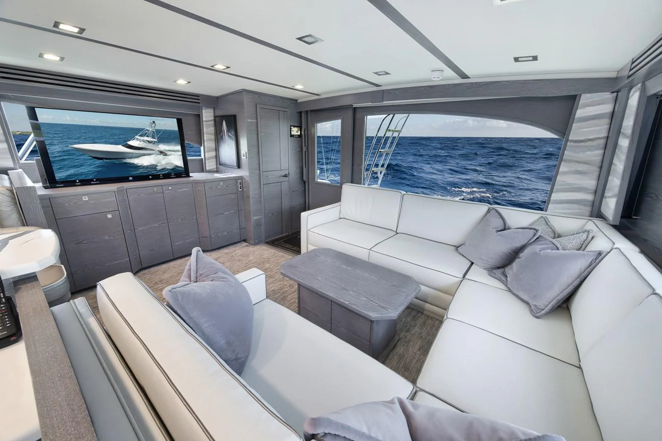 The salon features a spacious and elegant seating area with panoramic ocean views. aboard LADY SURFBUM Yacht for Sale