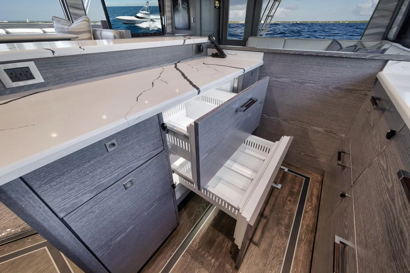The galley features modern cabinetry with sleek countertops and ample storage space. aboard LADY SURFBUM Yacht for Sale