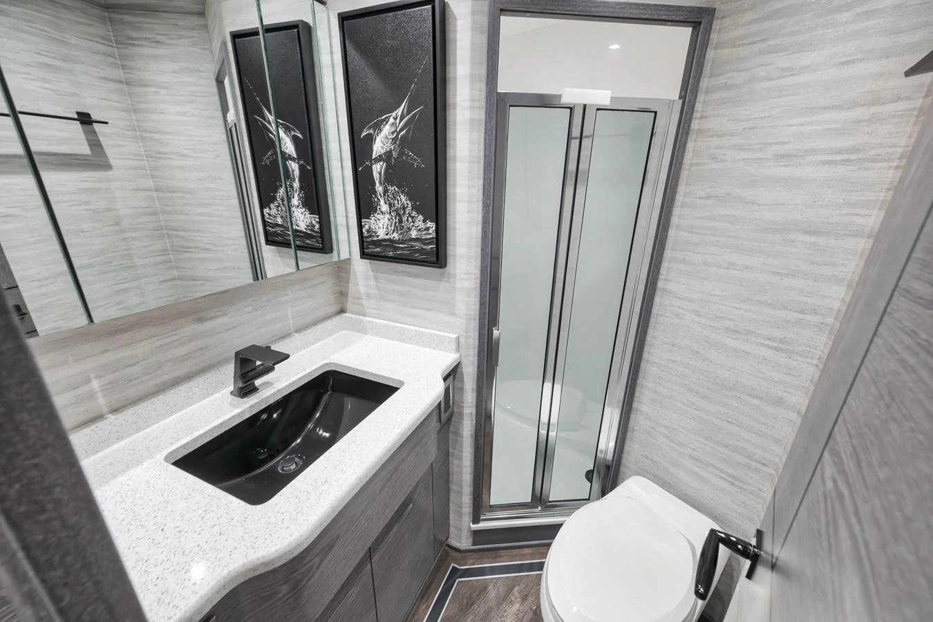The yacht's bathroom features a sleek design with modern fixtures and a spacious shower. aboard LADY SURFBUM Yacht for Sale