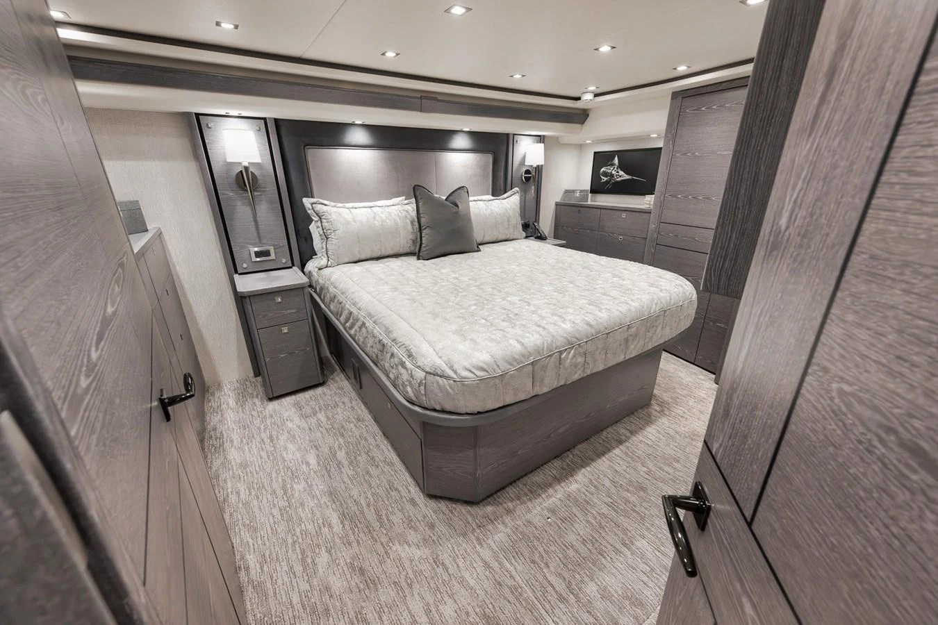 The master stateroom features a luxurious bed with elegant bedding and modern furnishings. aboard LADY SURFBUM Yacht for Sale