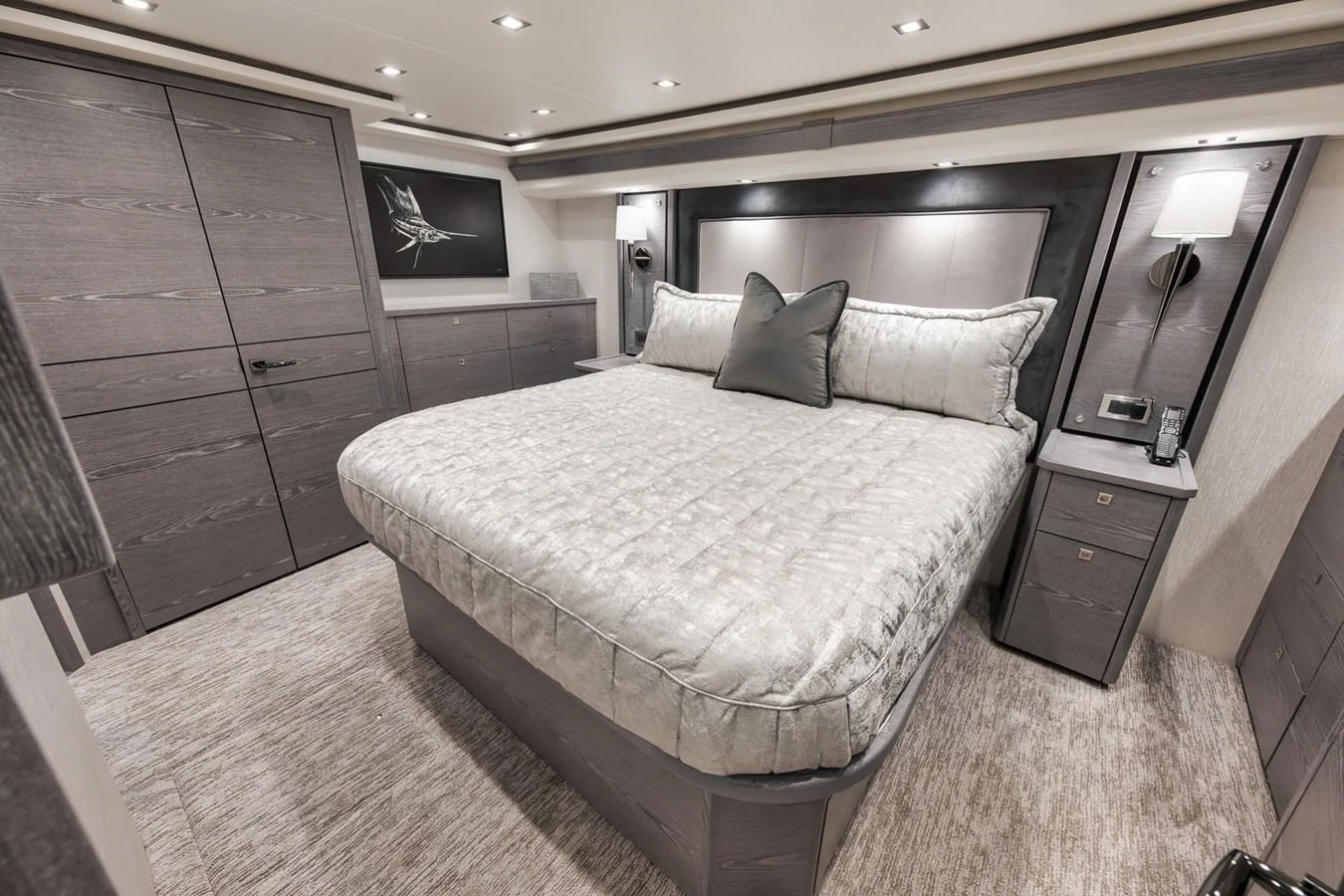 The stateroom features a plush bed with elegant bedding and modern furnishings. aboard LADY SURFBUM Yacht for Sale