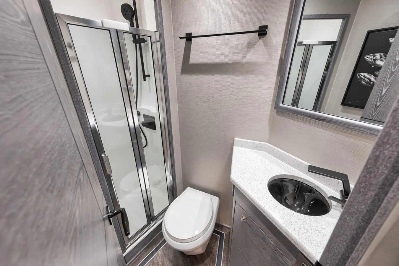 The yacht's bathroom features a modern shower, sleek fixtures, and a compact design. aboard LADY SURFBUM Yacht for Sale