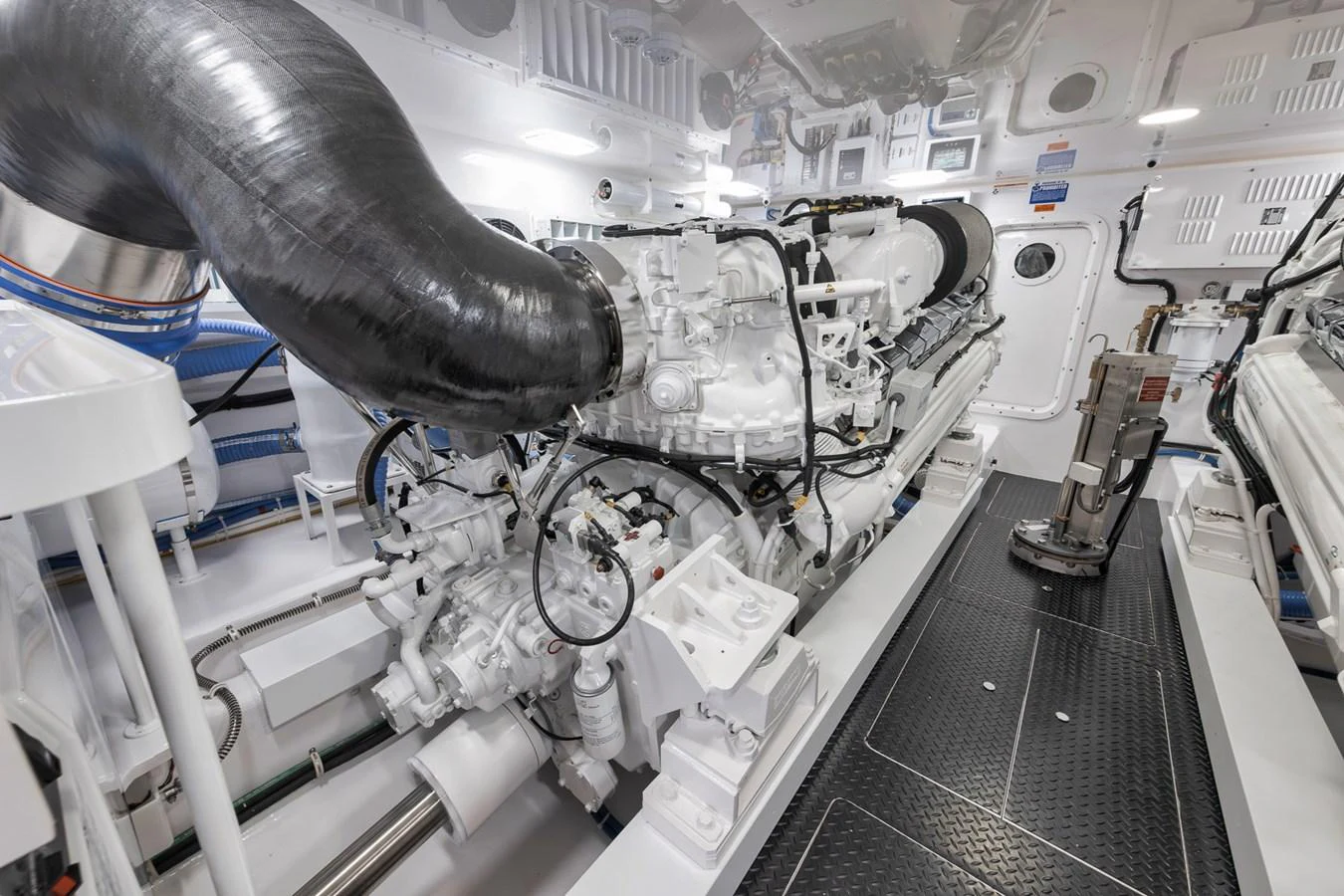 The image showcases the pristine engine room of the yacht, highlighting the advanced machinery and clean layout. aboard LADY SURFBUM Yacht for Sale