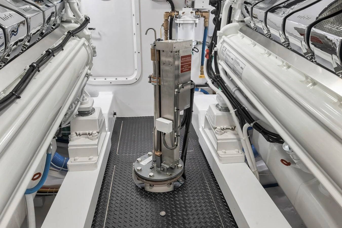 The image showcases the pristine and well-maintained engine room of the yacht. aboard LADY SURFBUM Yacht for Sale