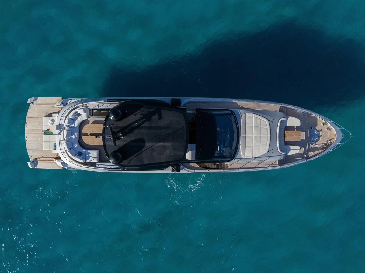 A stunning aerial view of a sleek yacht cruising through clear blue waters. aboard FILIPPETTI F100-03 Yacht for Sale