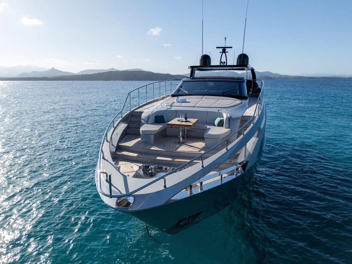 A sleek yacht with a spacious foredeck cruising on clear blue waters. aboard FILIPPETTI F100-03 Yacht for Sale