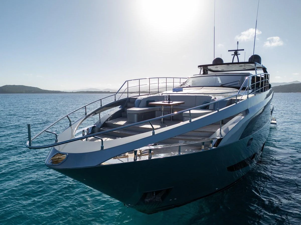 A sleek and modern yacht glides gracefully on calm waters under a clear sky. aboard FILIPPETTI F100-03 Yacht for Sale