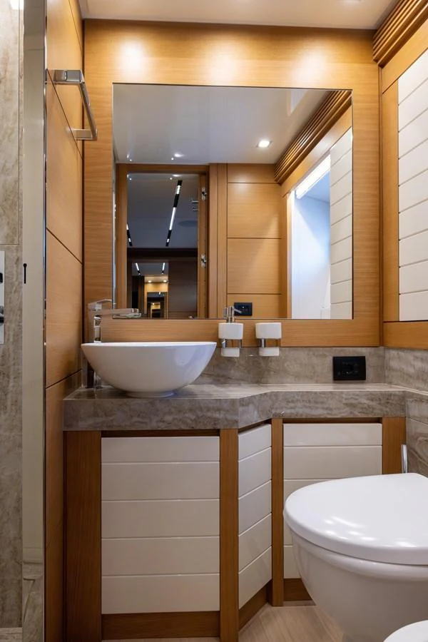 A sleek and modern yacht bathroom featuring a vessel sink and elegant fixtures. aboard FILIPPETTI F100-03 Yacht for Sale