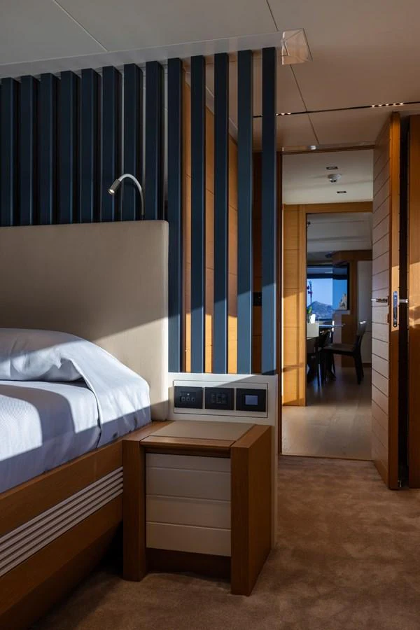A luxurious stateroom featuring a comfortable bed and modern design elements. aboard FILIPPETTI F100-03 Yacht for Sale