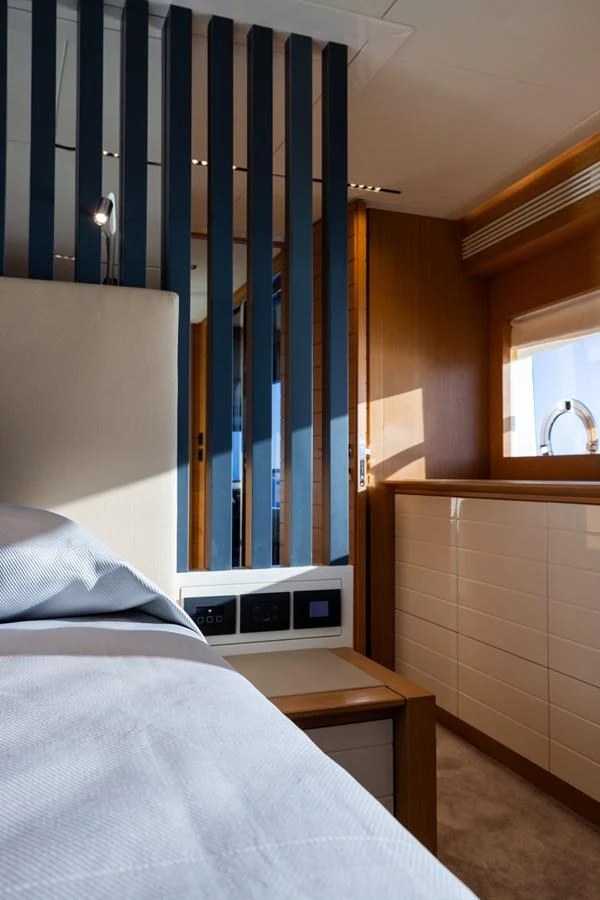 A cozy stateroom with modern design elements and natural light. aboard FILIPPETTI F100-03 Yacht for Sale