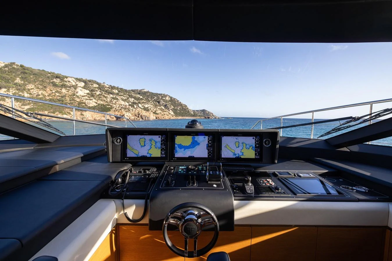 The helm station offers a commanding view with advanced navigation systems and luxurious finishes. aboard FILIPPETTI F100-03 Yacht for Sale