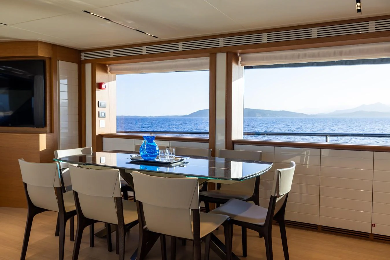 The yacht's dining area offers a serene setting with panoramic ocean views. aboard FILIPPETTI F100-03 Yacht for Sale