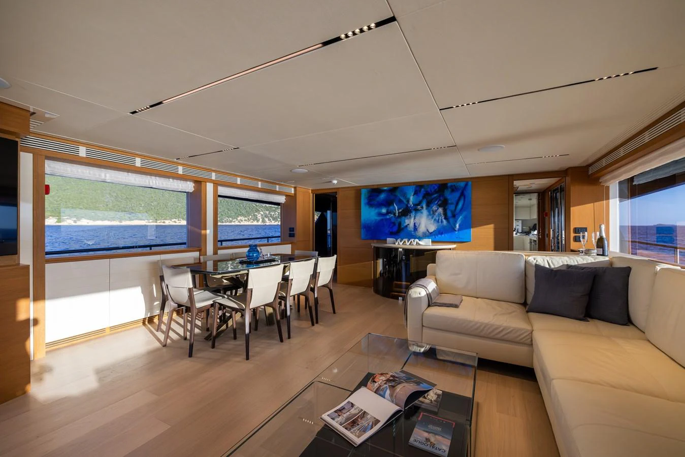 The salon features a spacious seating area with a modern design and large windows offering stunning views. aboard FILIPPETTI F100-03 Yacht for Sale