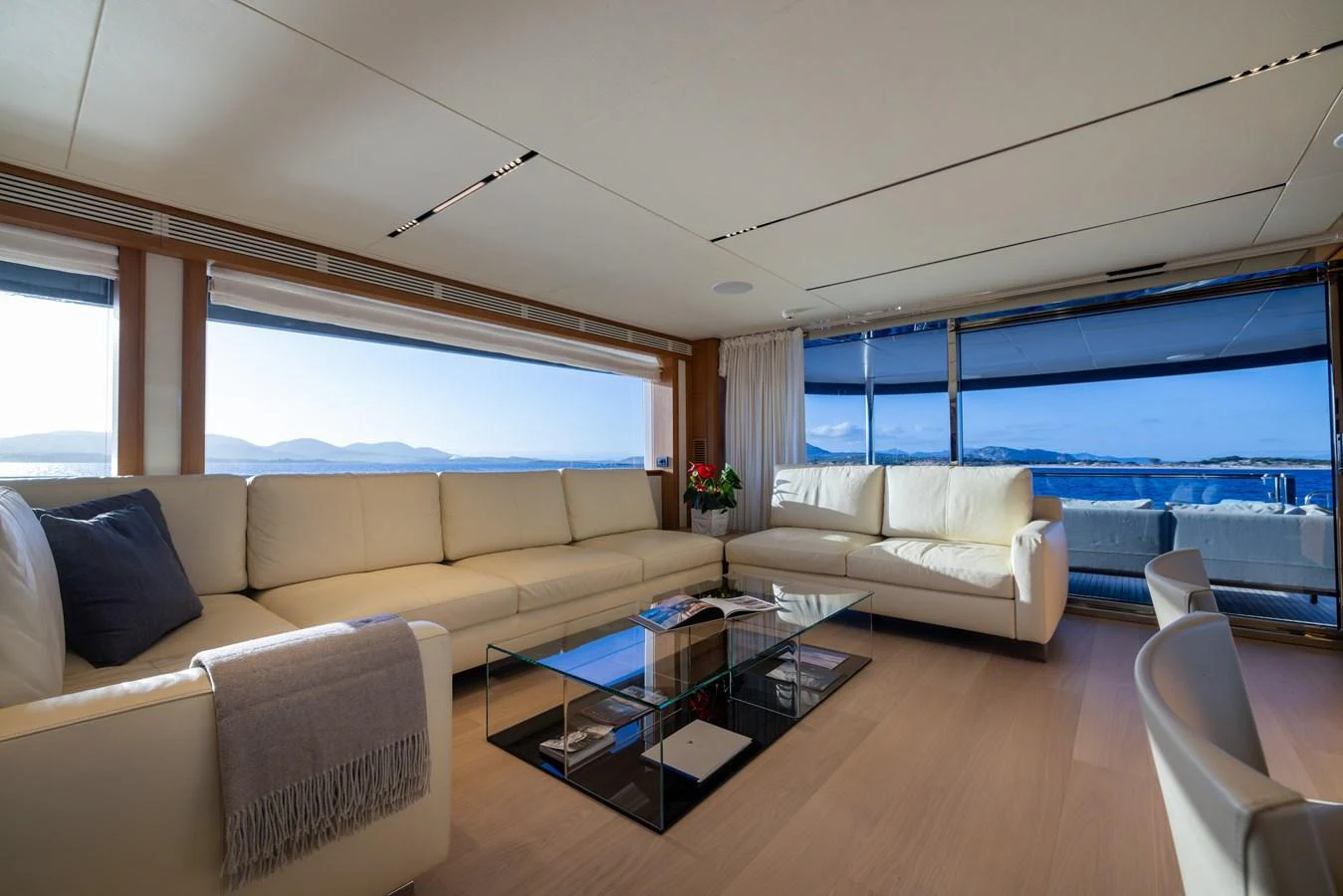The salon offers a spacious and luxurious seating area with panoramic views of the sea. aboard FILIPPETTI F100-03 Yacht for Sale