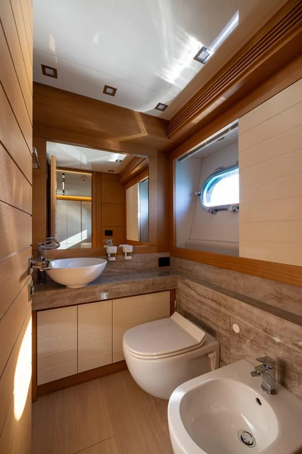 The yacht's bathroom features modern fixtures and a sleek design with ample natural light. aboard FILIPPETTI F100-03 Yacht for Sale