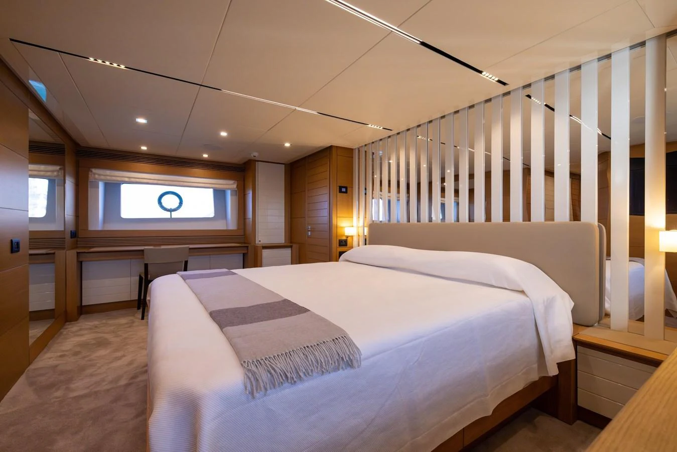 A luxurious stateroom featuring a large bed and modern decor. aboard FILIPPETTI F100-03 Yacht for Sale