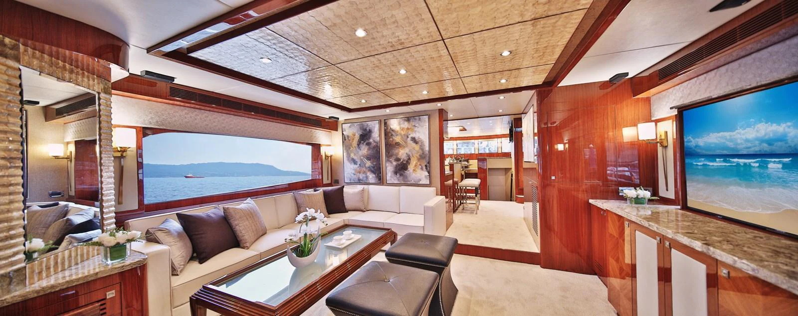 The yacht's salon features luxurious seating, elegant decor, and ample natural light. aboard JOHNSON 83' FLYBRIDGE W/HYDRAULIC PLATFORM Yacht for Sale