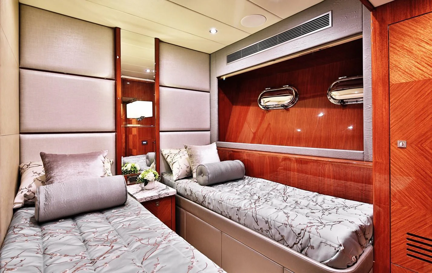 The guest stateroom features twin beds with luxurious bedding and elegant wood paneling. aboard JOHNSON 83' FLYBRIDGE W/HYDRAULIC PLATFORM Yacht for Sale