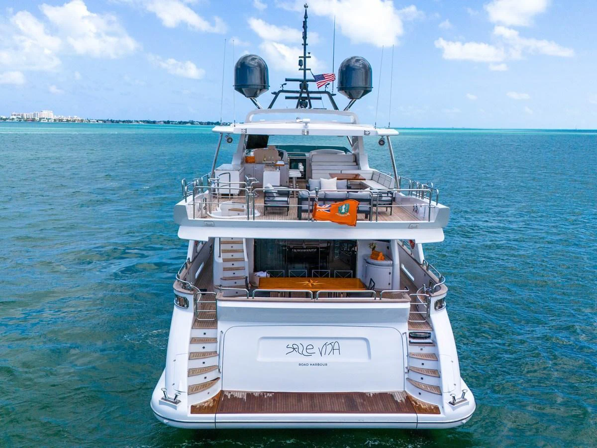 The yacht's aft deck offers a luxurious space for relaxation and entertainment, with stunning views of the surrounding waters. aboard AZIMUT GRANDE 105 Yacht for Sale