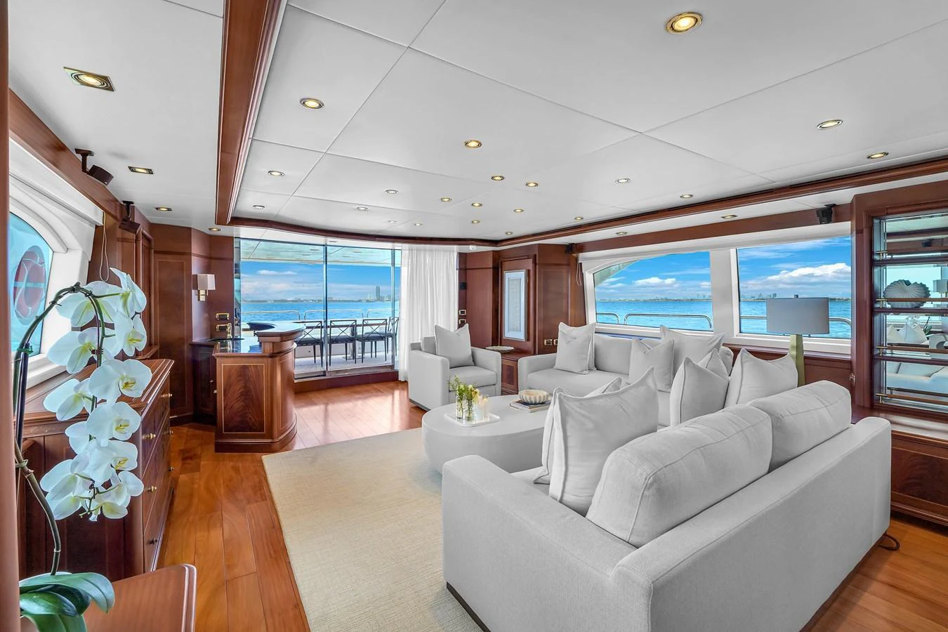 The salon offers a spacious and elegant seating area with panoramic views of the sea. aboard AZIMUT GRANDE 105 Yacht for Sale