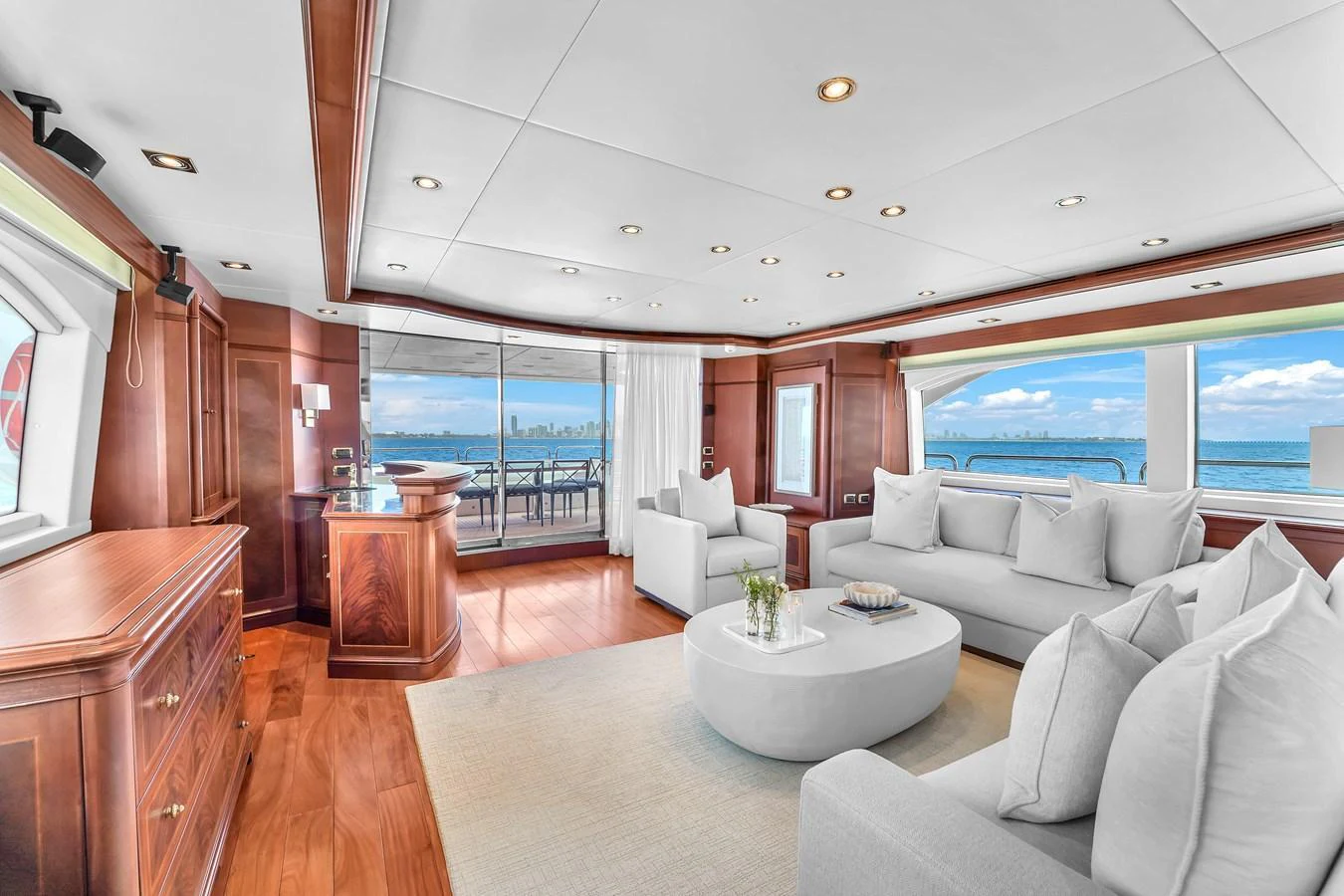The yacht's salon offers a spacious and elegant seating area with panoramic ocean views. aboard AZIMUT GRANDE 105 Yacht for Sale