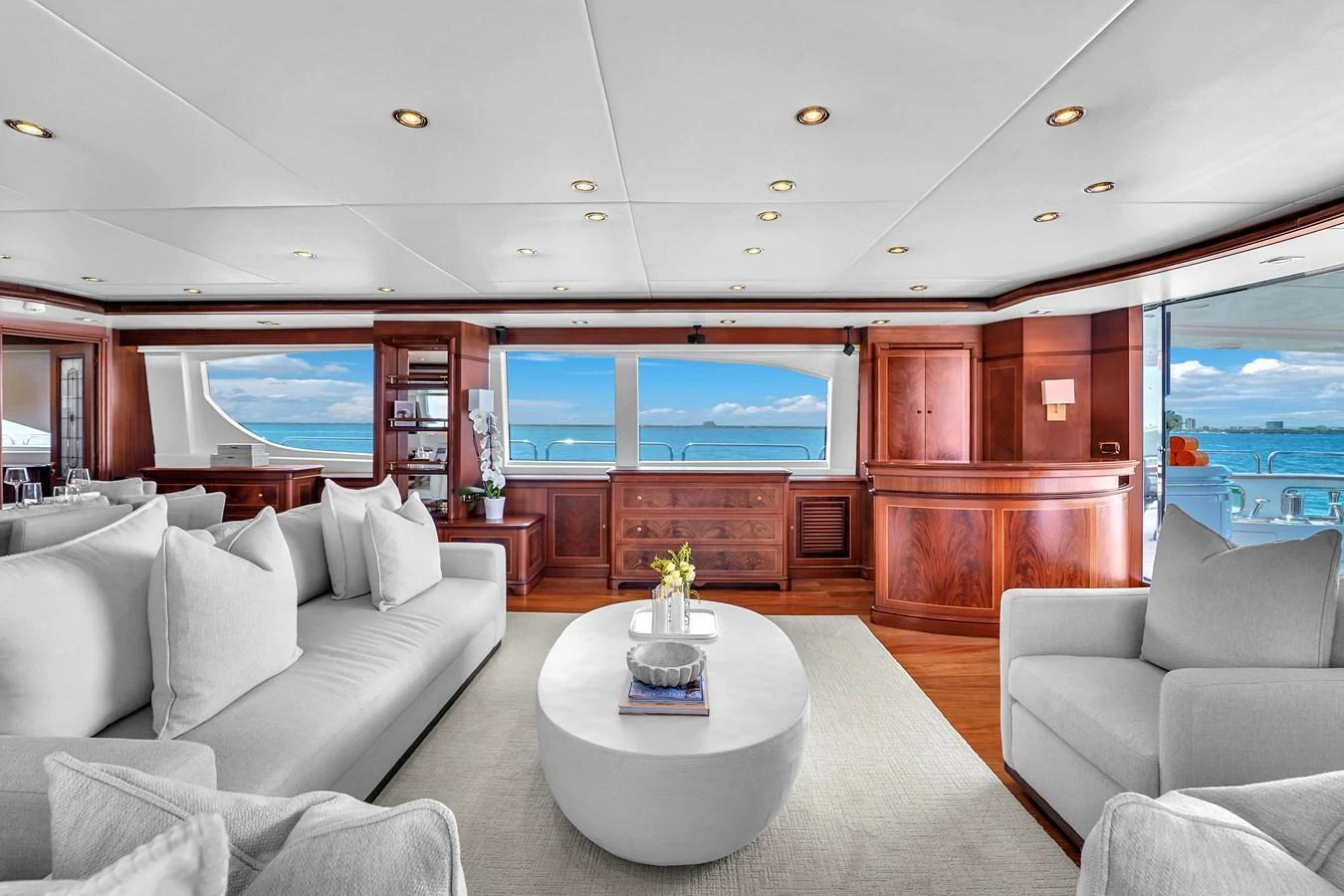 The salon offers a spacious and elegant area with plush seating and panoramic views. aboard AZIMUT GRANDE 105 Yacht for Sale
