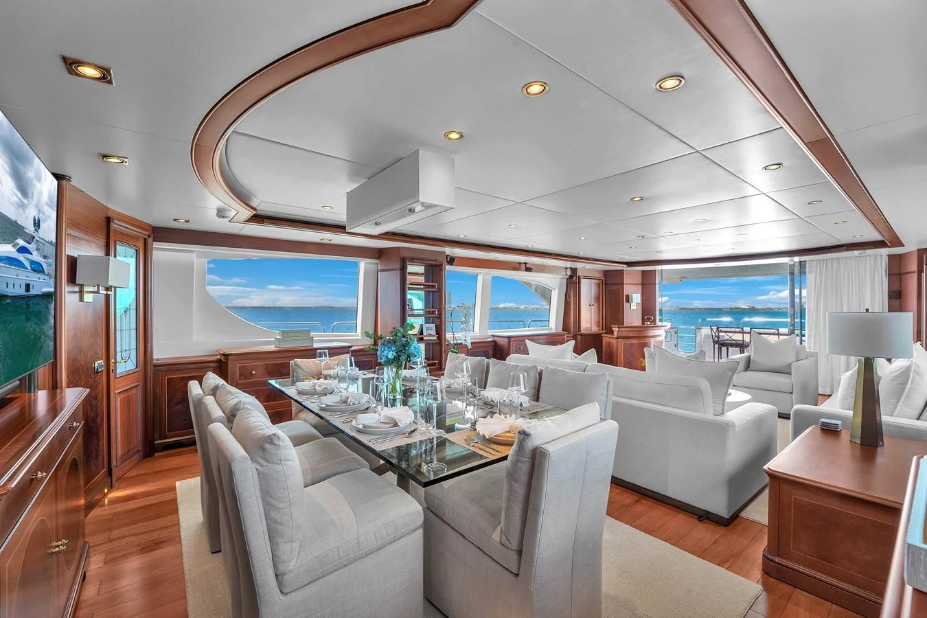 The yacht's salon features elegant furnishings and expansive ocean views, creating a luxurious and inviting atmosphere. aboard AZIMUT GRANDE 105 Yacht for Sale