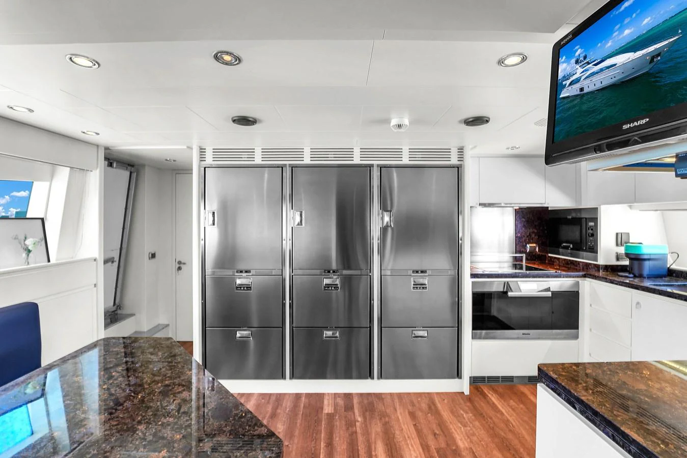 The galley features modern stainless steel appliances and a sleek design. aboard AZIMUT GRANDE 105 Yacht for Sale