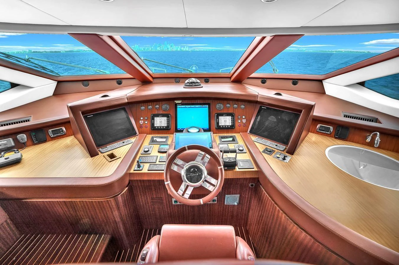 The helm of the yacht features state-of-the-art navigation equipment and a panoramic view of the sea. aboard AZIMUT GRANDE 105 Yacht for Sale