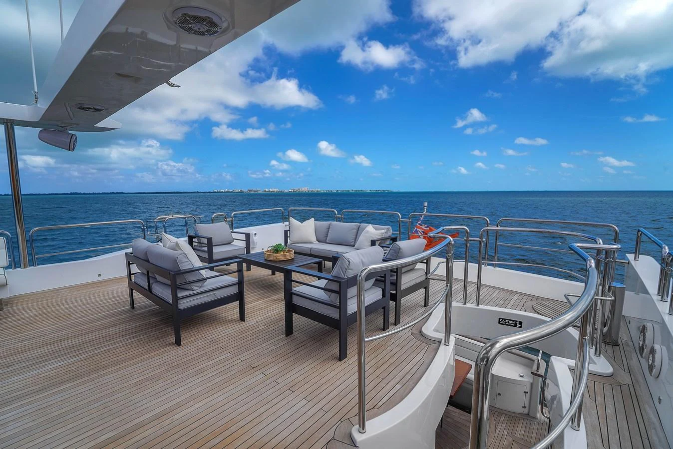 The aft deck offers a luxurious seating area with stunning ocean views. aboard AZIMUT GRANDE 105 Yacht for Sale