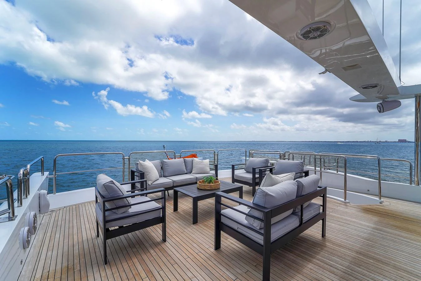 The aft deck offers a luxurious outdoor seating area with stunning ocean views. aboard AZIMUT GRANDE 105 Yacht for Sale