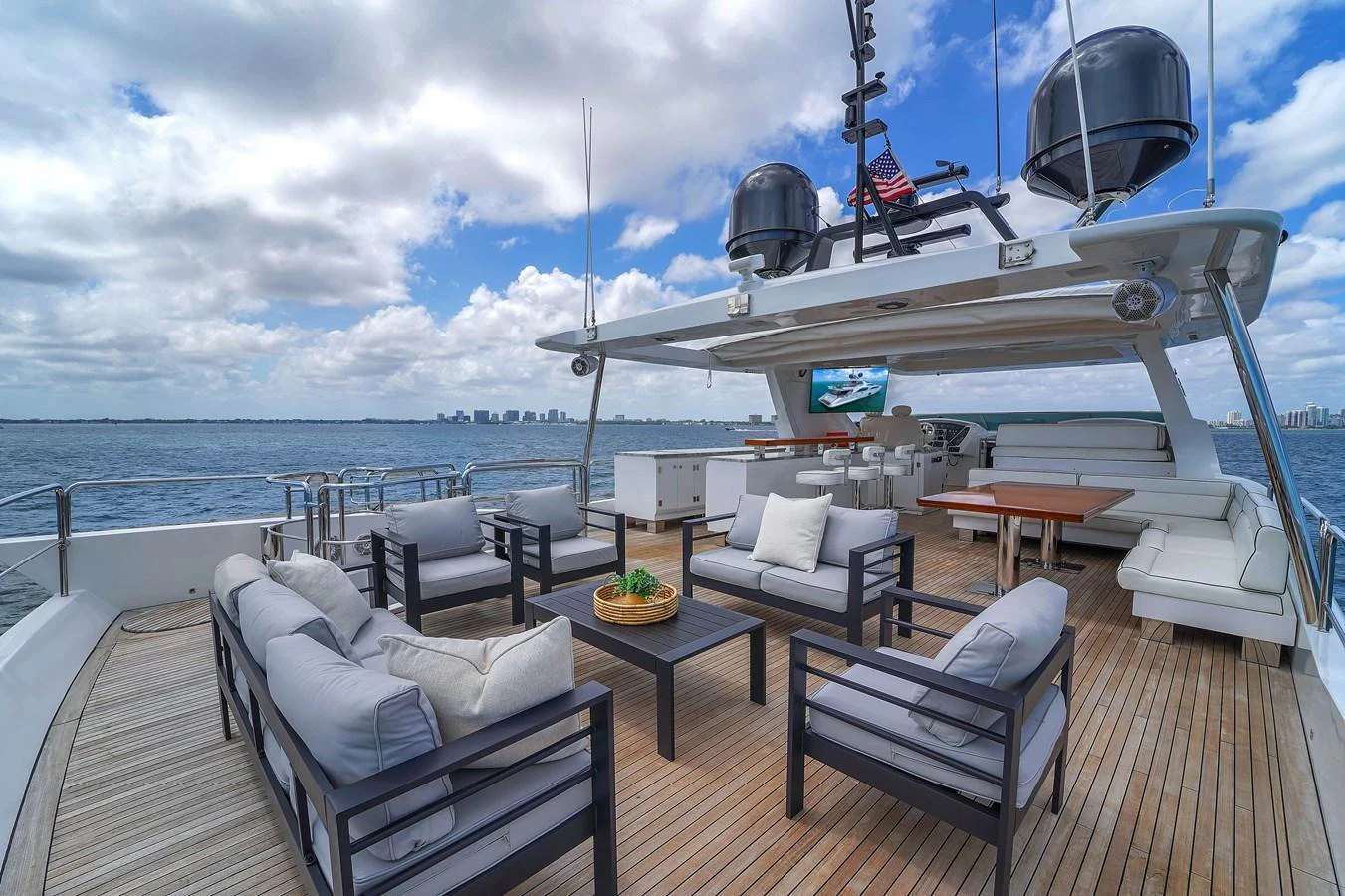 The flybridge offers a spacious and luxurious outdoor seating area with stunning views of the water. aboard AZIMUT GRANDE 105 Yacht for Sale