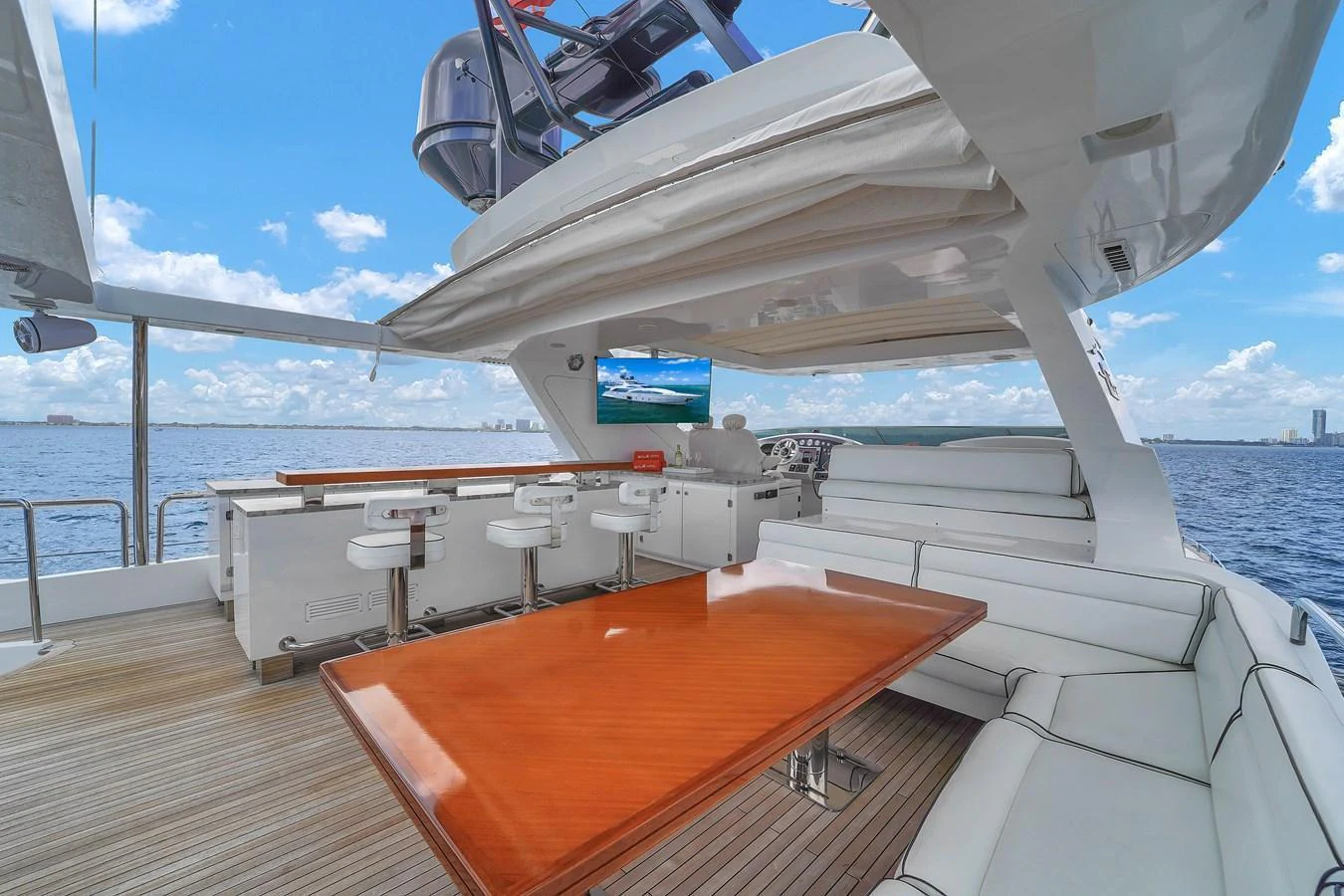 The flybridge offers a spacious and luxurious area for relaxation and entertainment with stunning ocean views. aboard AZIMUT GRANDE 105 Yacht for Sale