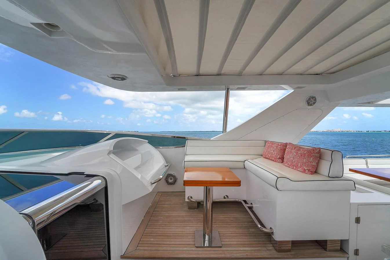 The flybridge offers a comfortable seating area with a stunning ocean view. aboard AZIMUT GRANDE 105 Yacht for Sale
