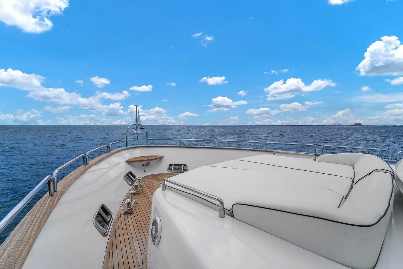 The foredeck offers a spacious sunbathing area with stunning ocean views. aboard AZIMUT GRANDE 105 Yacht for Sale