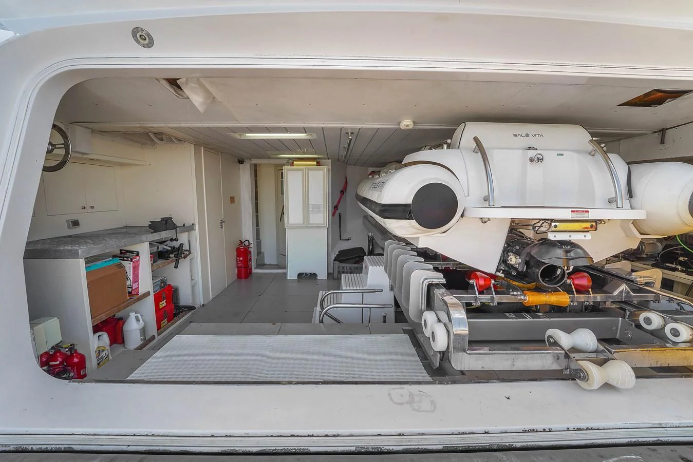 The yacht's tender garage houses a well-maintained tender, ready for excursions. aboard AZIMUT GRANDE 105 Yacht for Sale